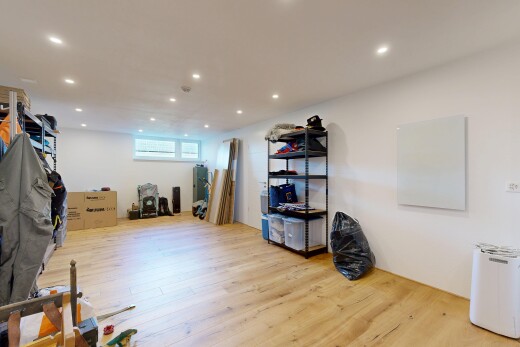 workout area with light wood finished floors