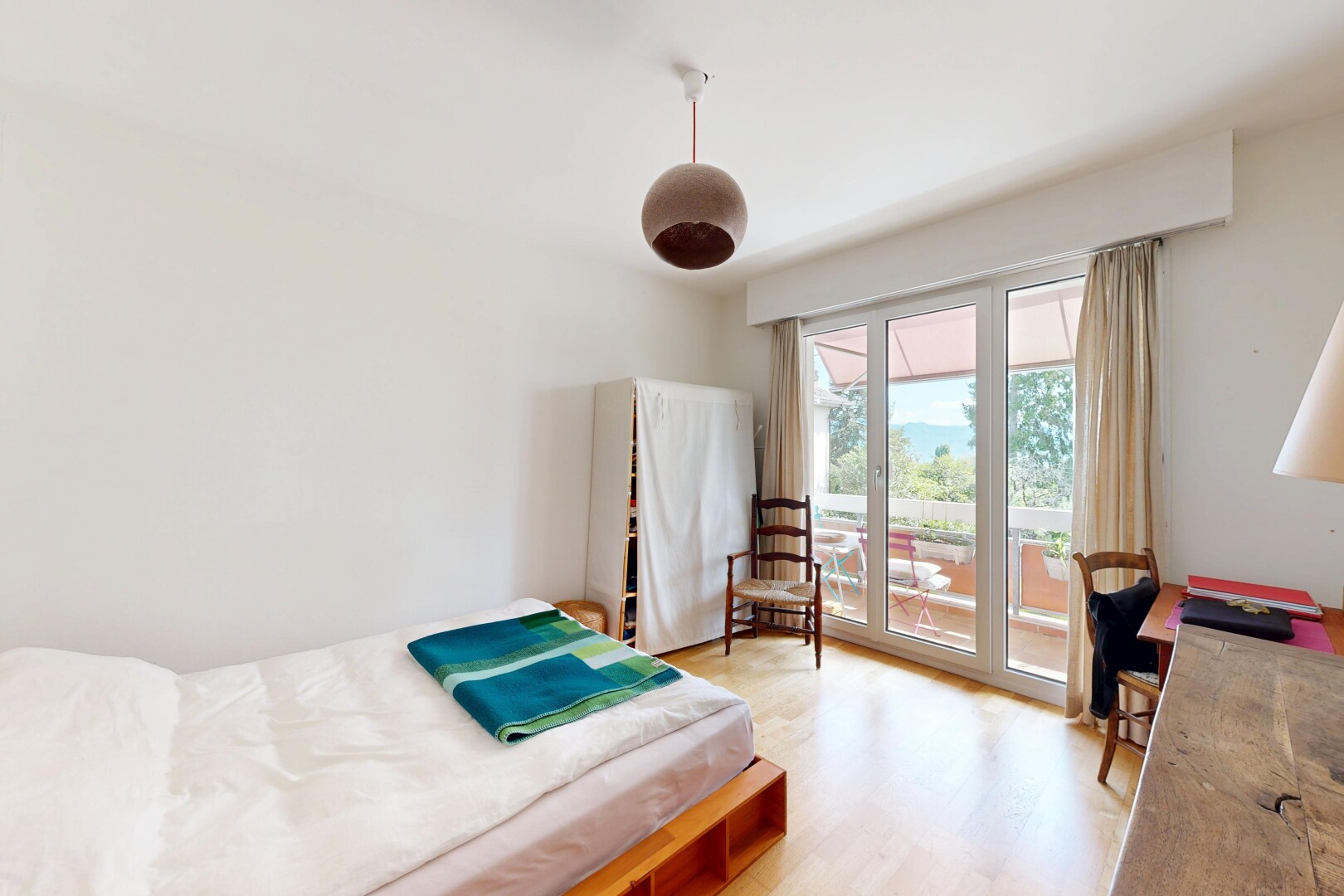 room / bedroom with light wood-type flooring, access to exterior, and ceiling fan
