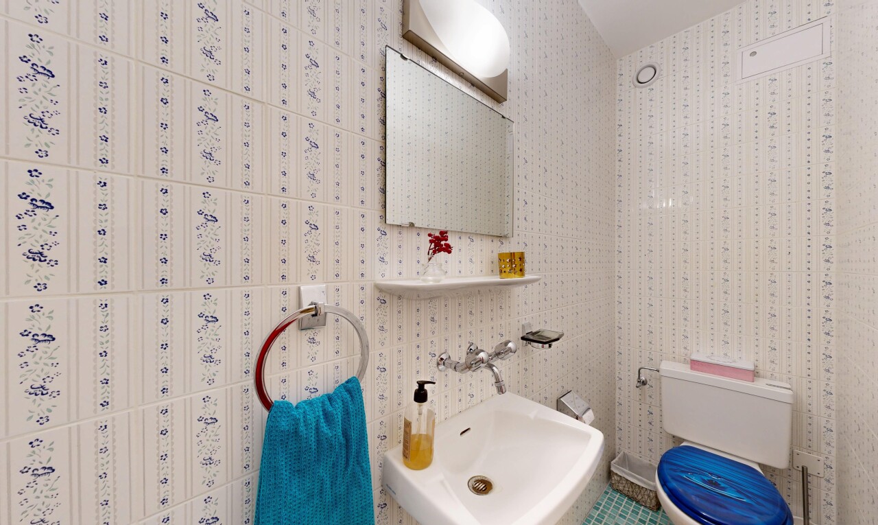 bathroom featuring toilet and a sink