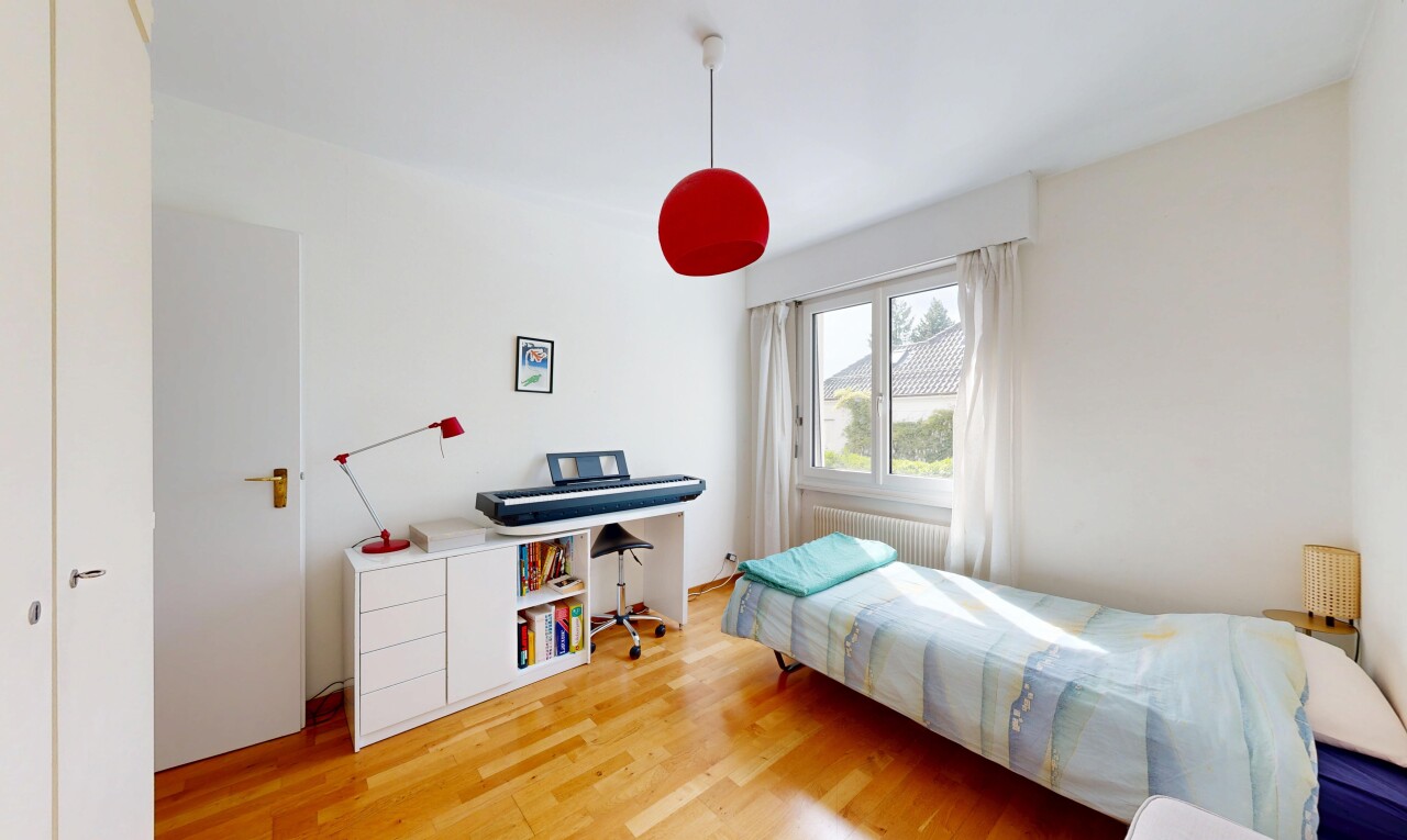 room featuring light wood-type flooring and radiator heating unit