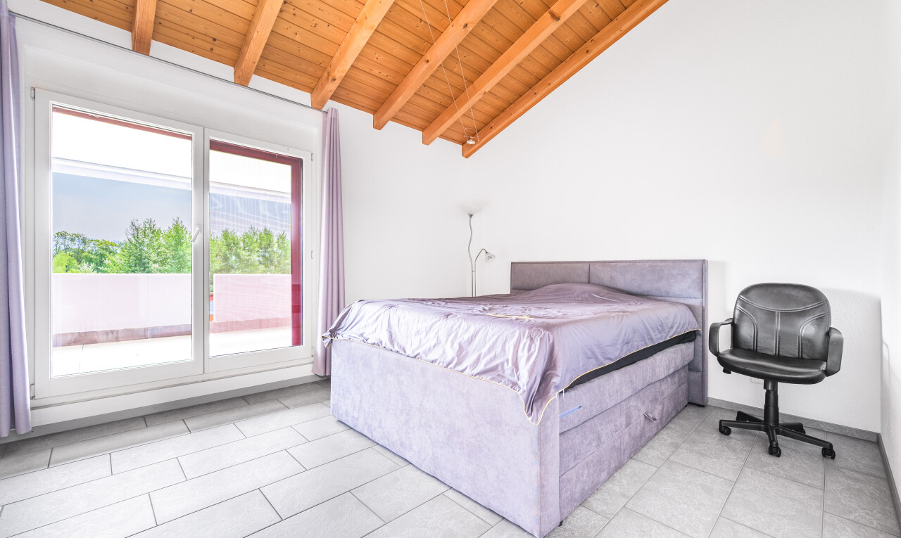 room with access to exterior, a wooden ceiling with exposed beams, light tile patterned flooring, and high vaulted ceiling