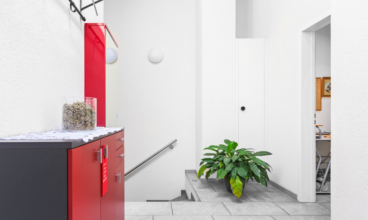 kitchen featuring light tile patterned floors and light stone countertops