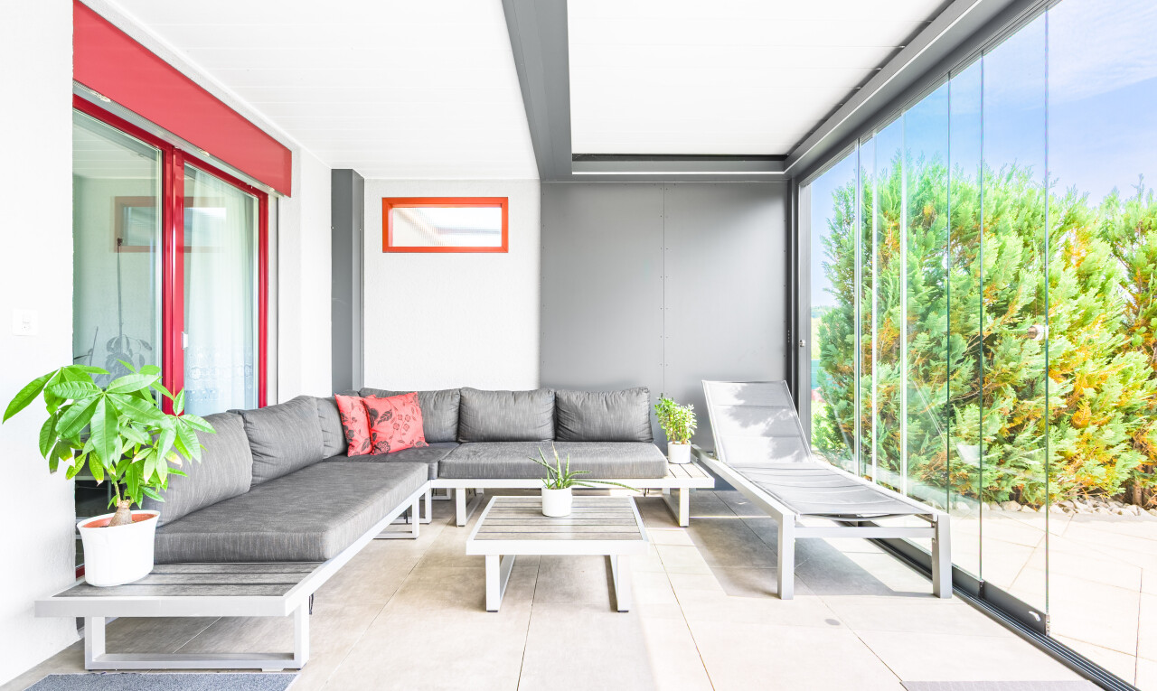 patio / terrace with outdoor lounge area and a sunroom