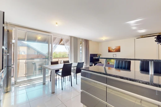view of tiled living / dining room