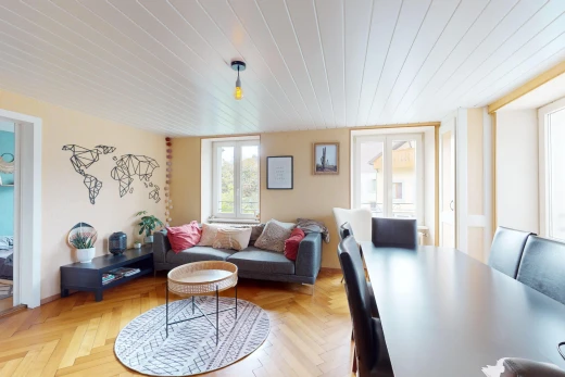 living / dining room with wooden ceiling and light parquet floors
