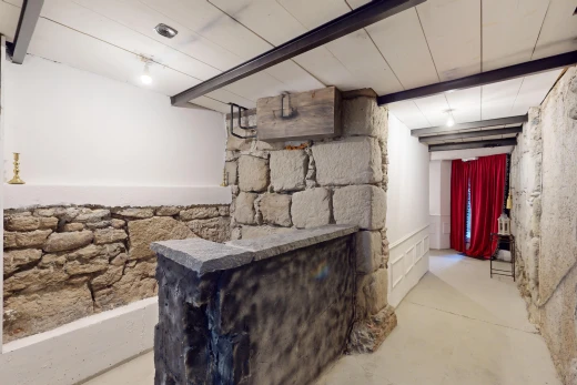 interior space with beam ceiling and concrete floors