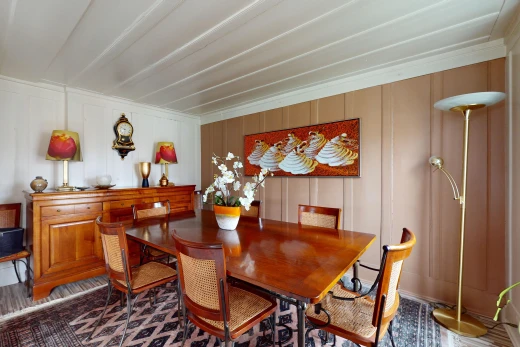 dining space with ornamental molding