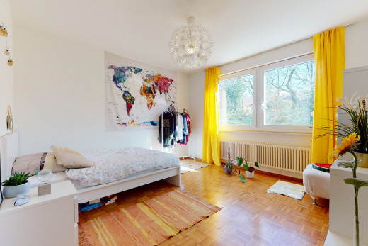 chambre à coucher avec parquet, lumière naturelle, et radiateur