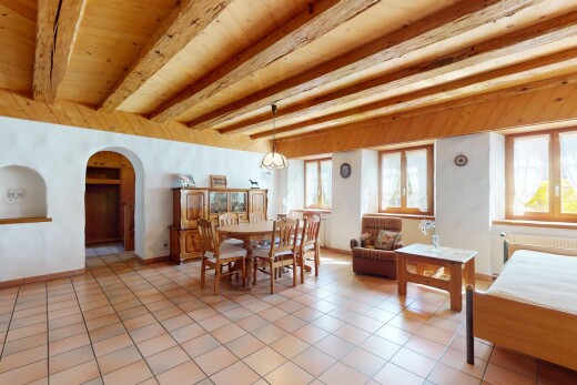 esszimmer mit fliesenboden, balkendecke, gewölbte gehwege, und kühler