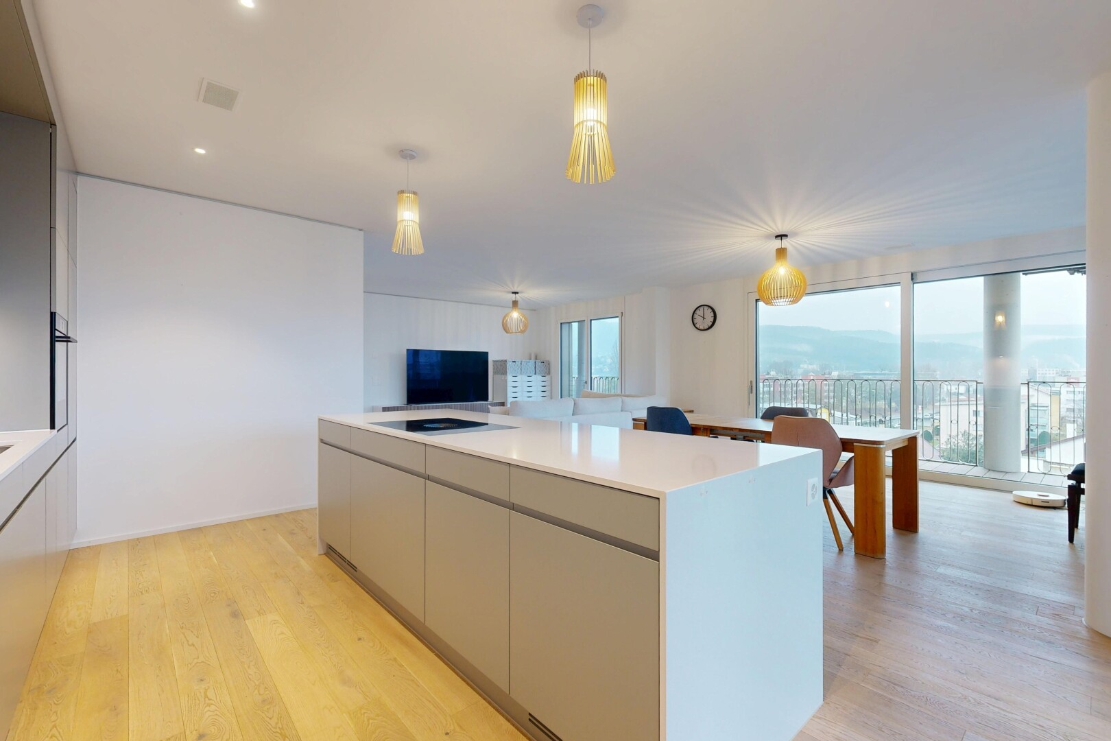kitchen featuring modern cabinets, gray cabinetry, light wood finished floors, open floor plan, and a center island