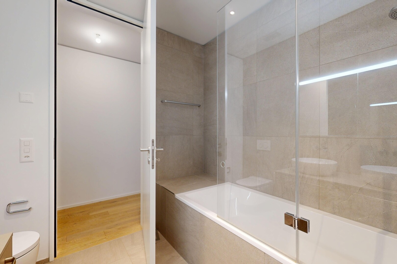 full bathroom with tiled shower / bath and light tile patterned floors