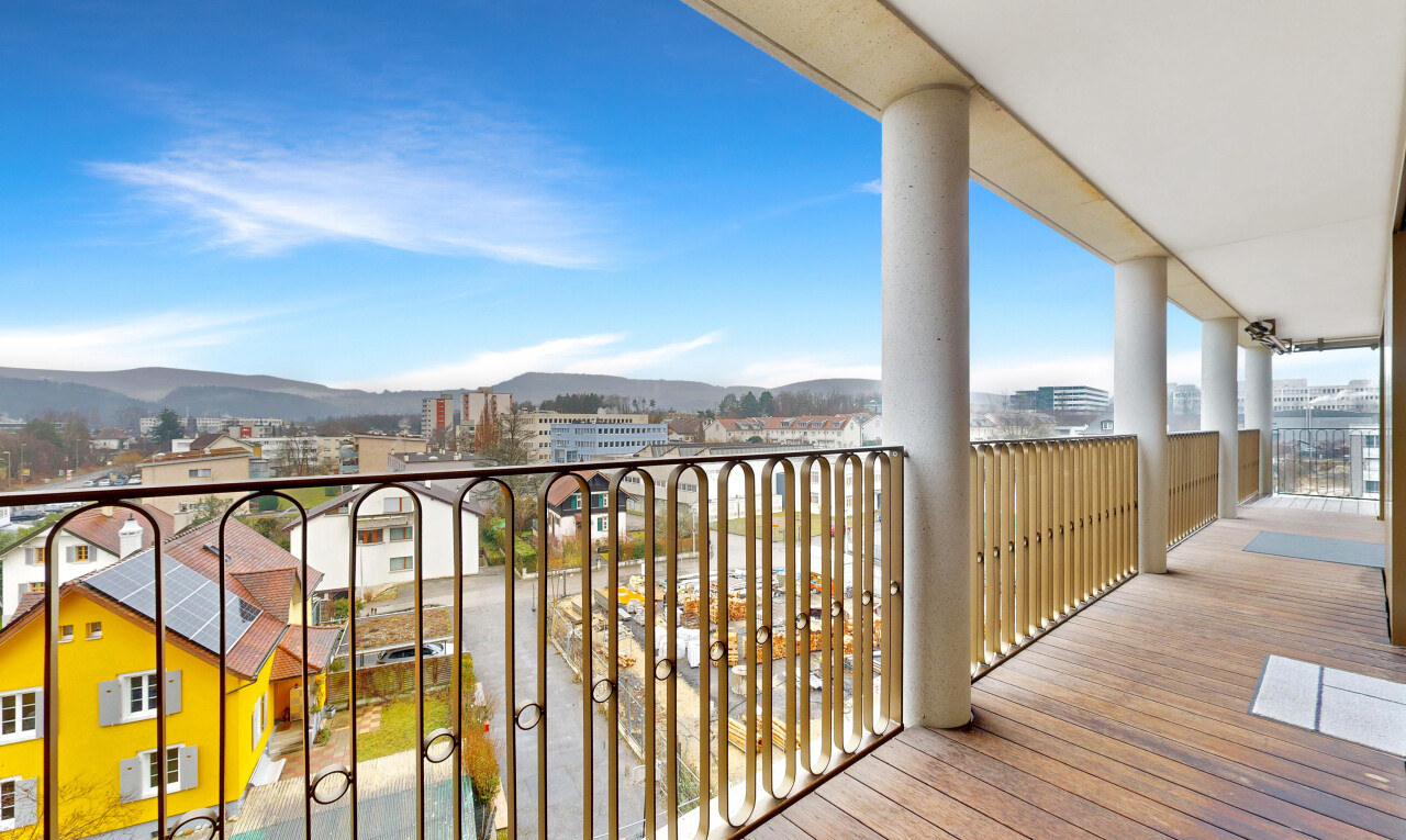 balcony featuring a mountain view and a city view