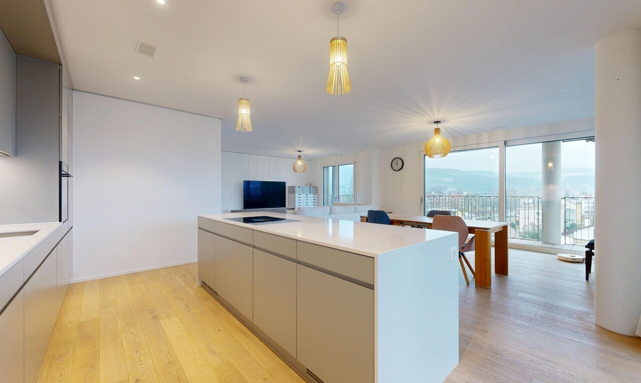 kitchen featuring modern cabinets, gray cabinetry, light wood finished floors, open floor plan, and a center island