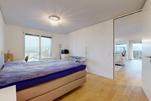 room with light wood-style flooring, access to outside, and a chandelier