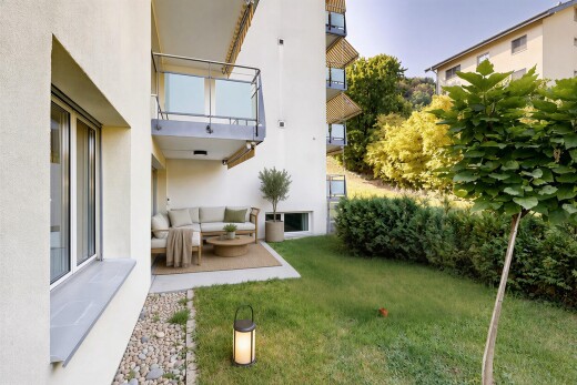 garden with a yard, outdoor lounge area, a patio area, and a balcony