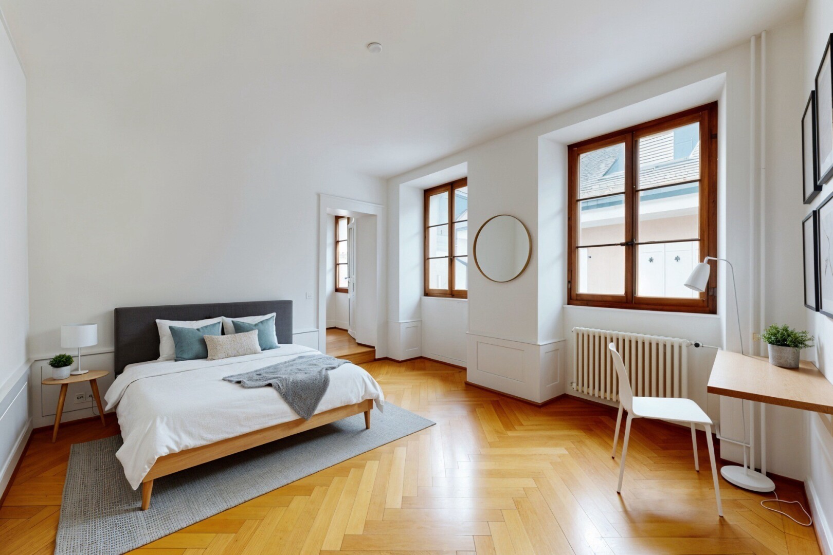 spare room with radiator heating unit, wainscoting, parquet floors, and a decorative wall
