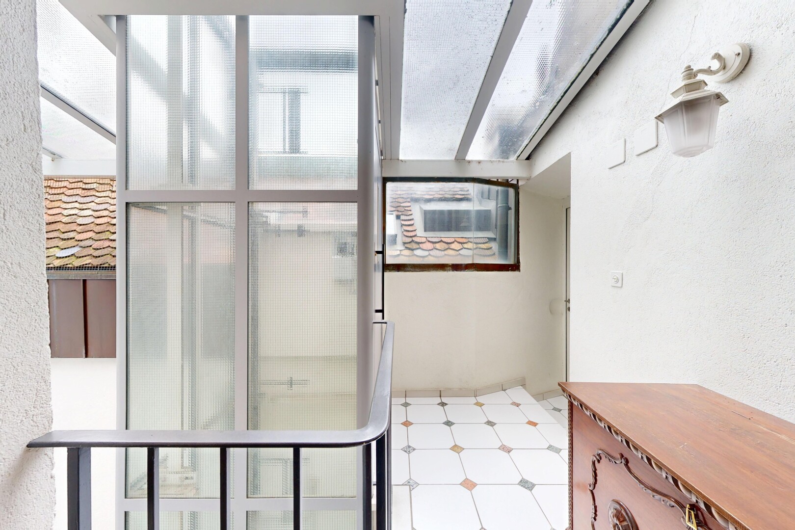 patio / terrace featuring a sunroom