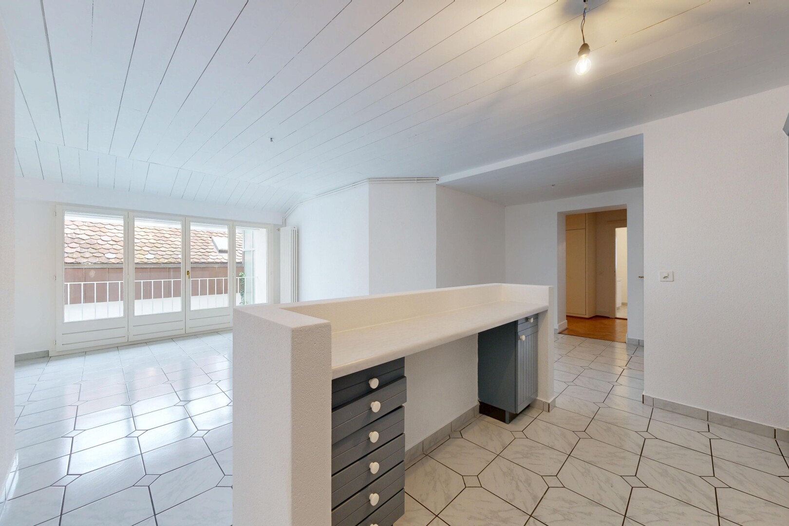 empty room featuring wood ceiling and light tile patterned floors