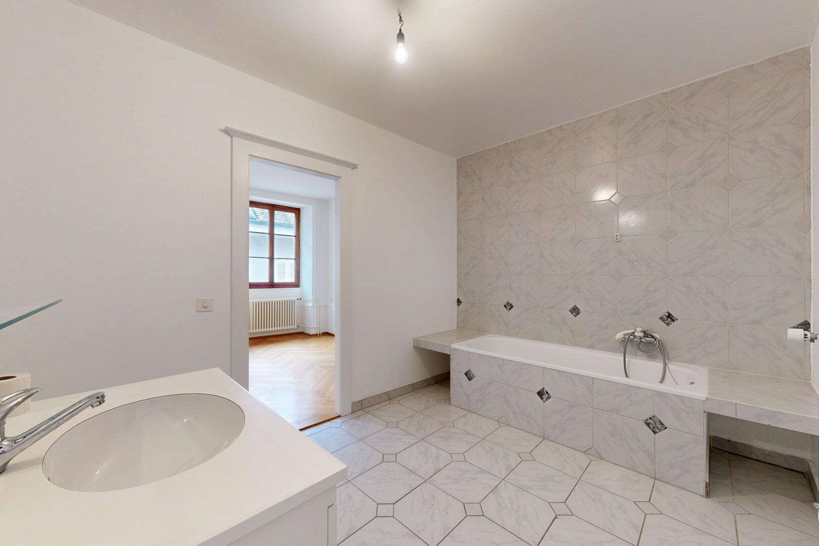 full bath with vanity, a garden tub, radiator heating unit, and light tile patterned floors