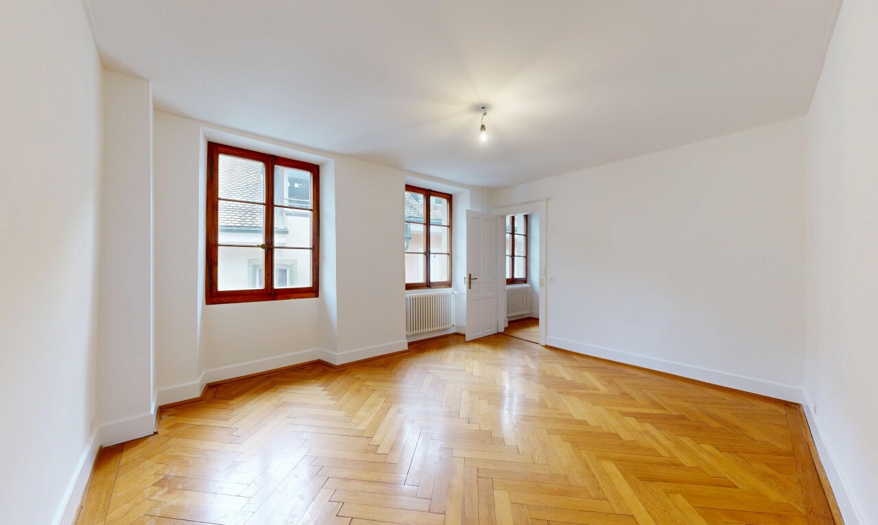 unfurnished room featuring parquet floors and radiator