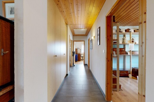 hallway featuring wood ceiling and wood finished floors