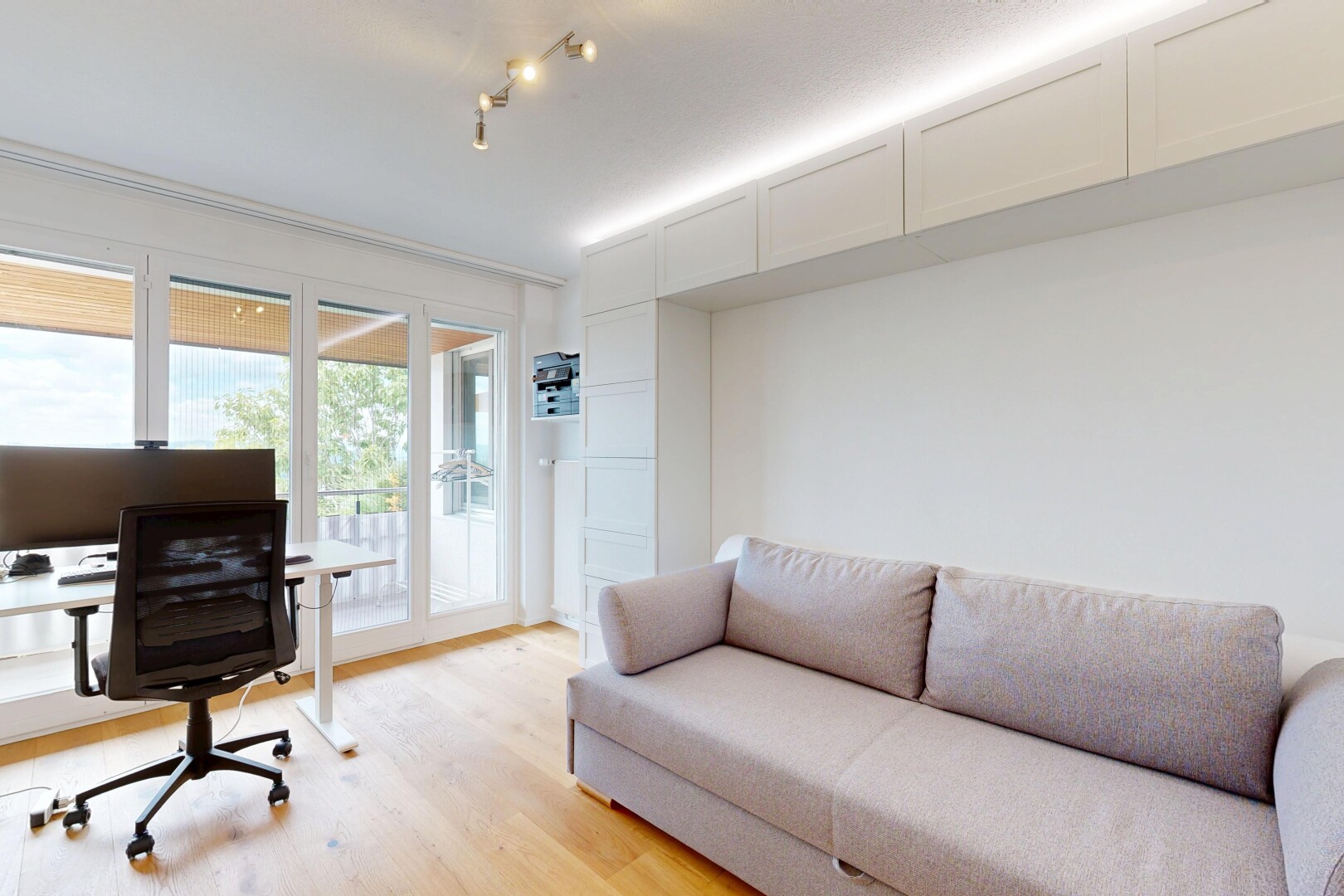 living room featuring light wood finished floors and an office area