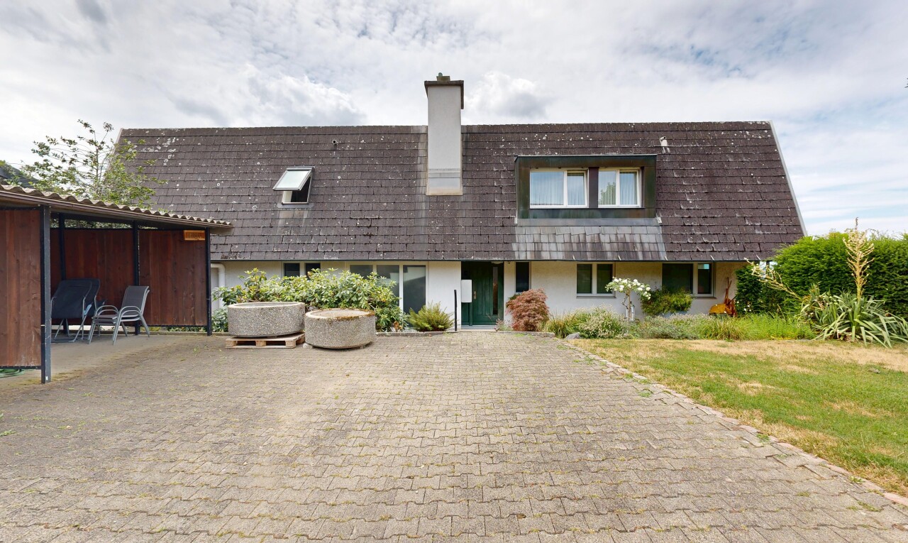 outdoor house featuring a chimney