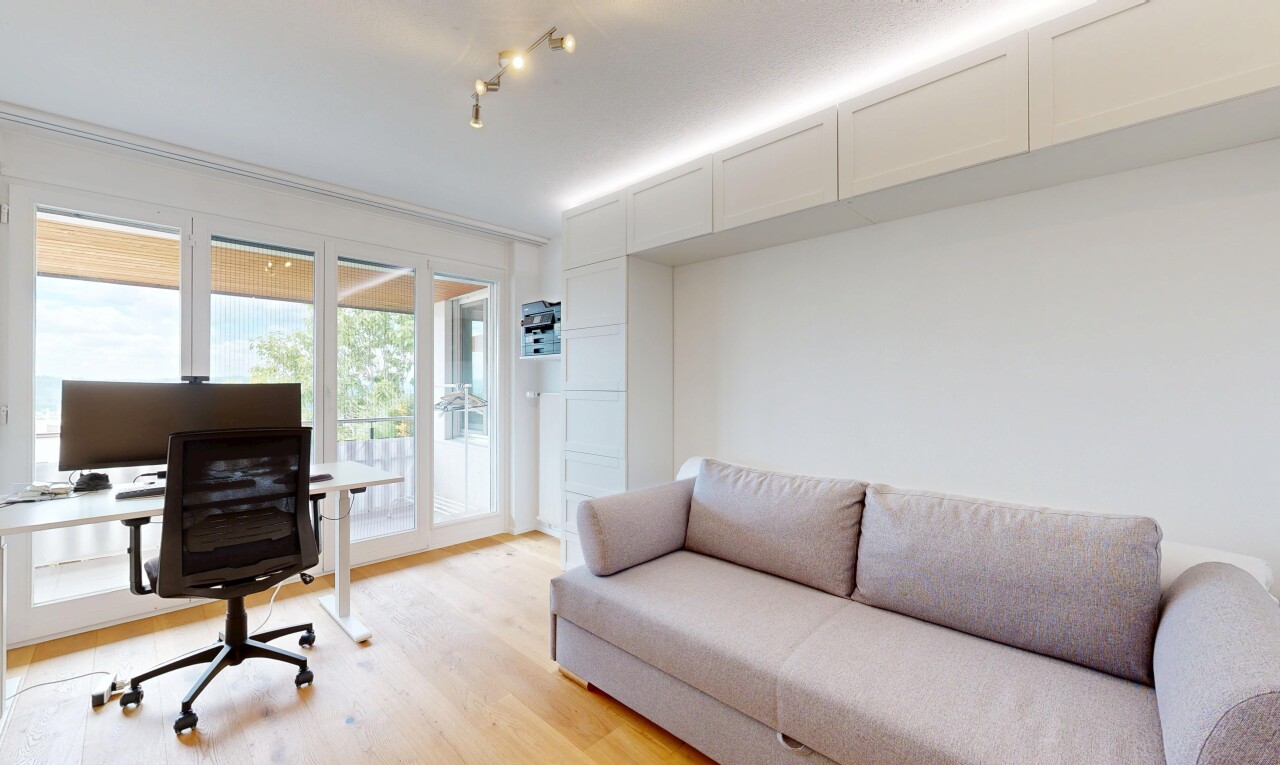 living room featuring light wood finished floors and an office area
