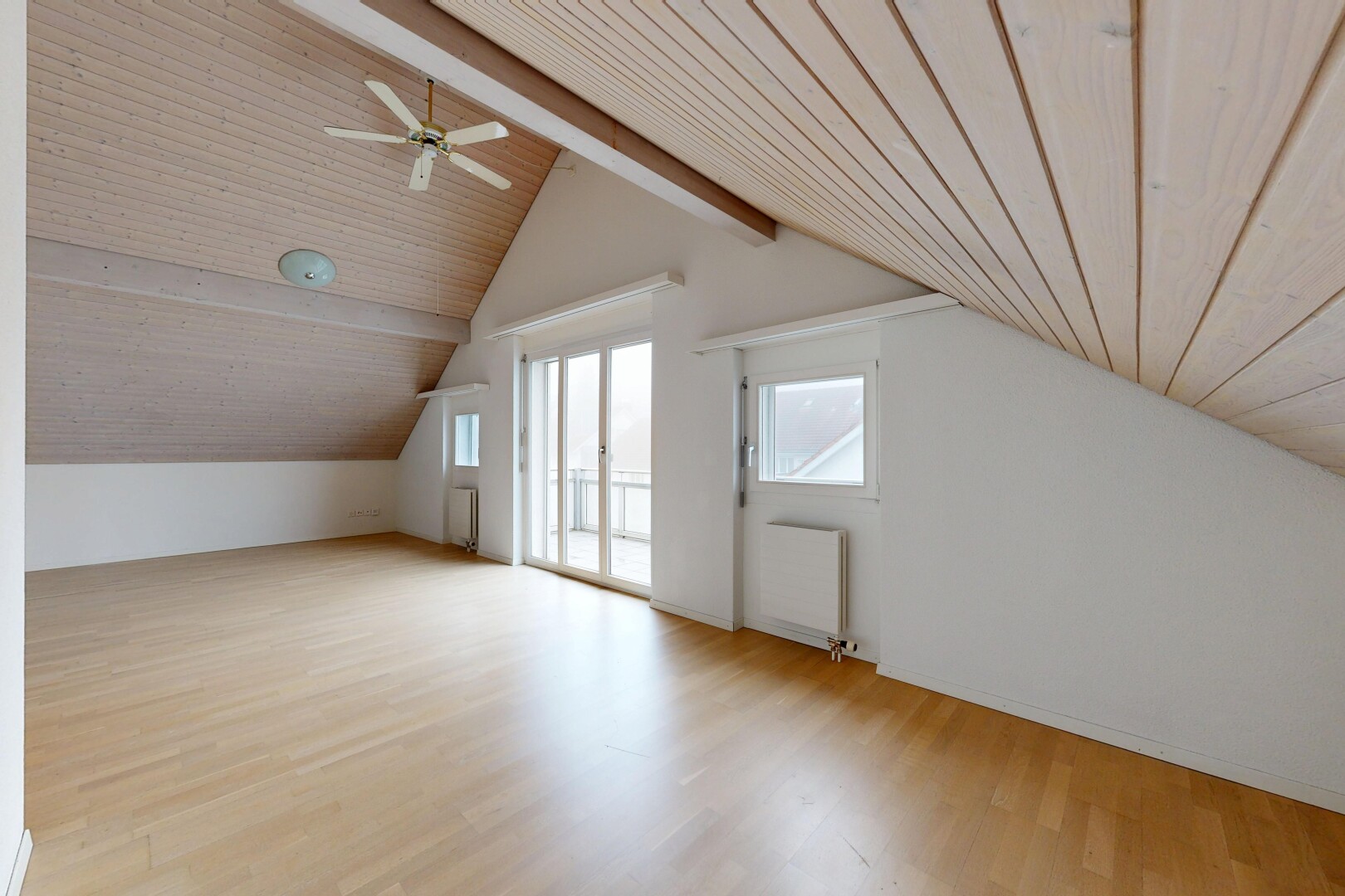spare room with light wood finished floors, wooden ceiling, a ceiling fan, and radiator