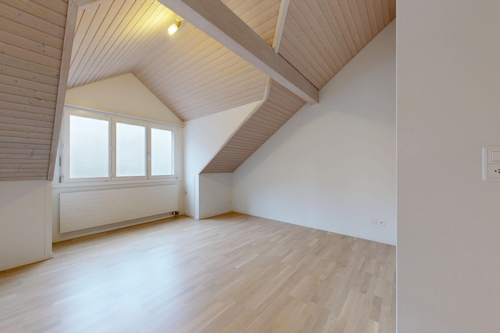 unfurnished room featuring light wood-style flooring and wooden ceiling