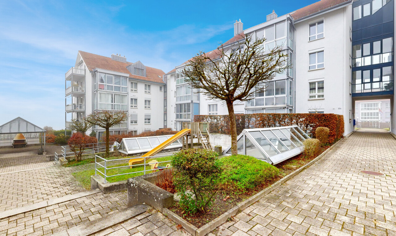 view of apartment building / complex featuring an exterior structure