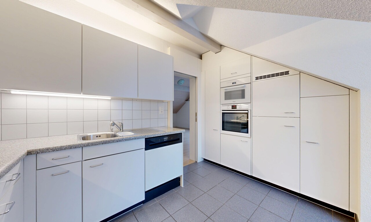 kitchen featuring light countertops, dishwasher, dark tile patterned flooring, double oven, and backsplash