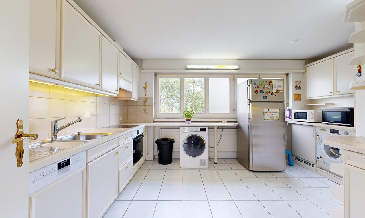kitchen with stainless steel appliances, washer / dryer, white cabinets, backsplash, and light tile patterned floors