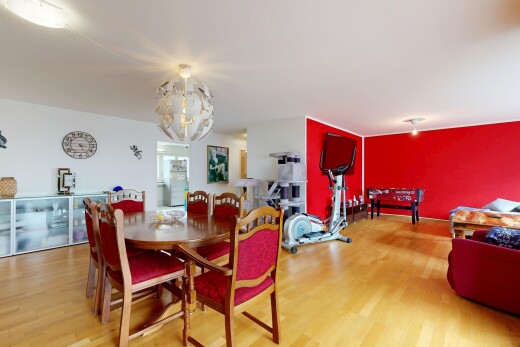 living area featuring light wood finished floors and hanging lights