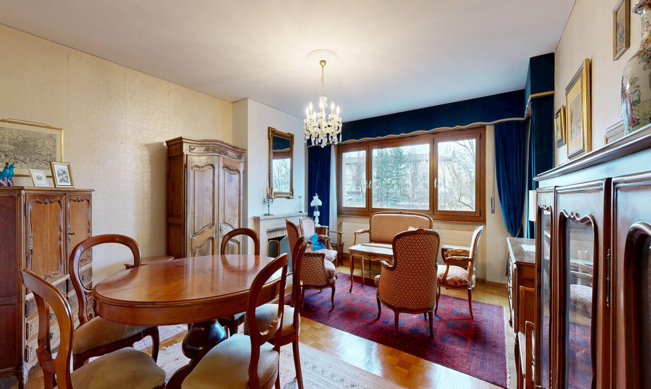 dining room featuring parquet floors and a chandelier