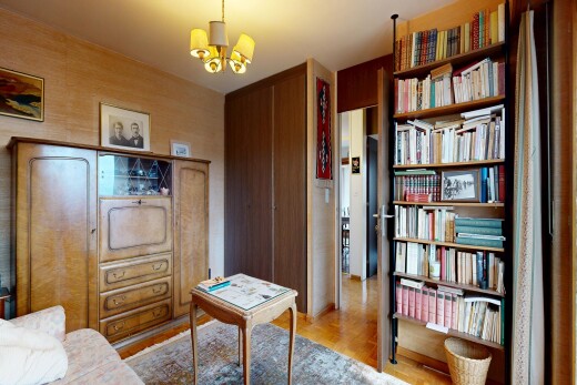 living room with light wood-style flooring and a chandelier