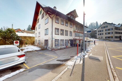extérieur du bâtiment avec parking