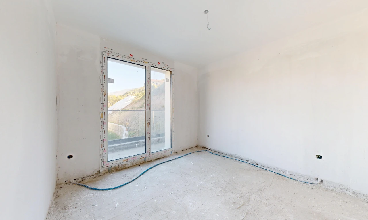 pièce vide avec unfinished floor, inside property, drywall, et cloison sèche