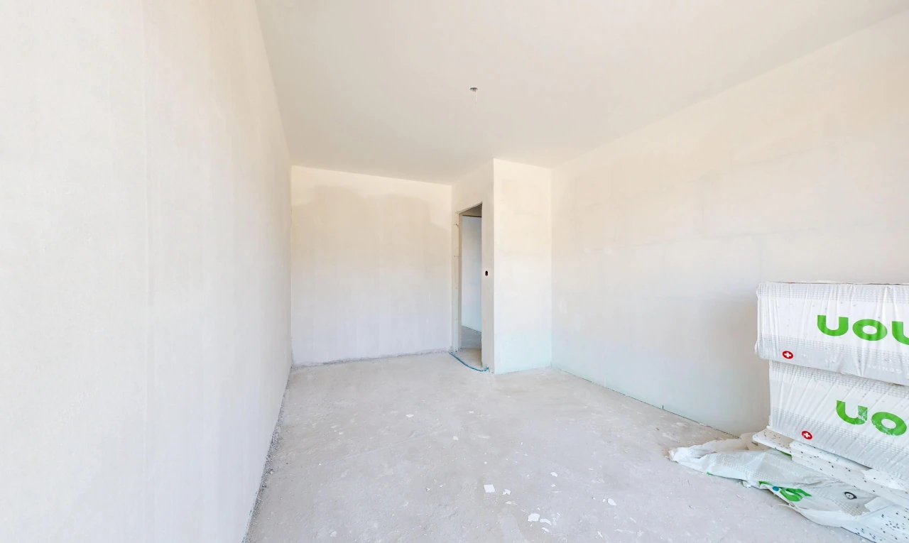 pièce vide avec inside property, concrete floor, sol en béton, et unfinished concrete floor