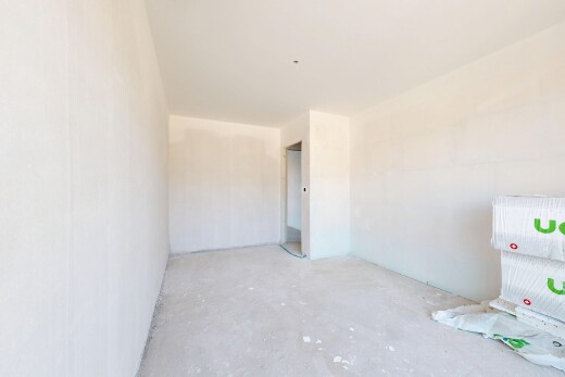 pièce vide avec inside property, concrete floor, sol en béton, et unfinished concrete floor