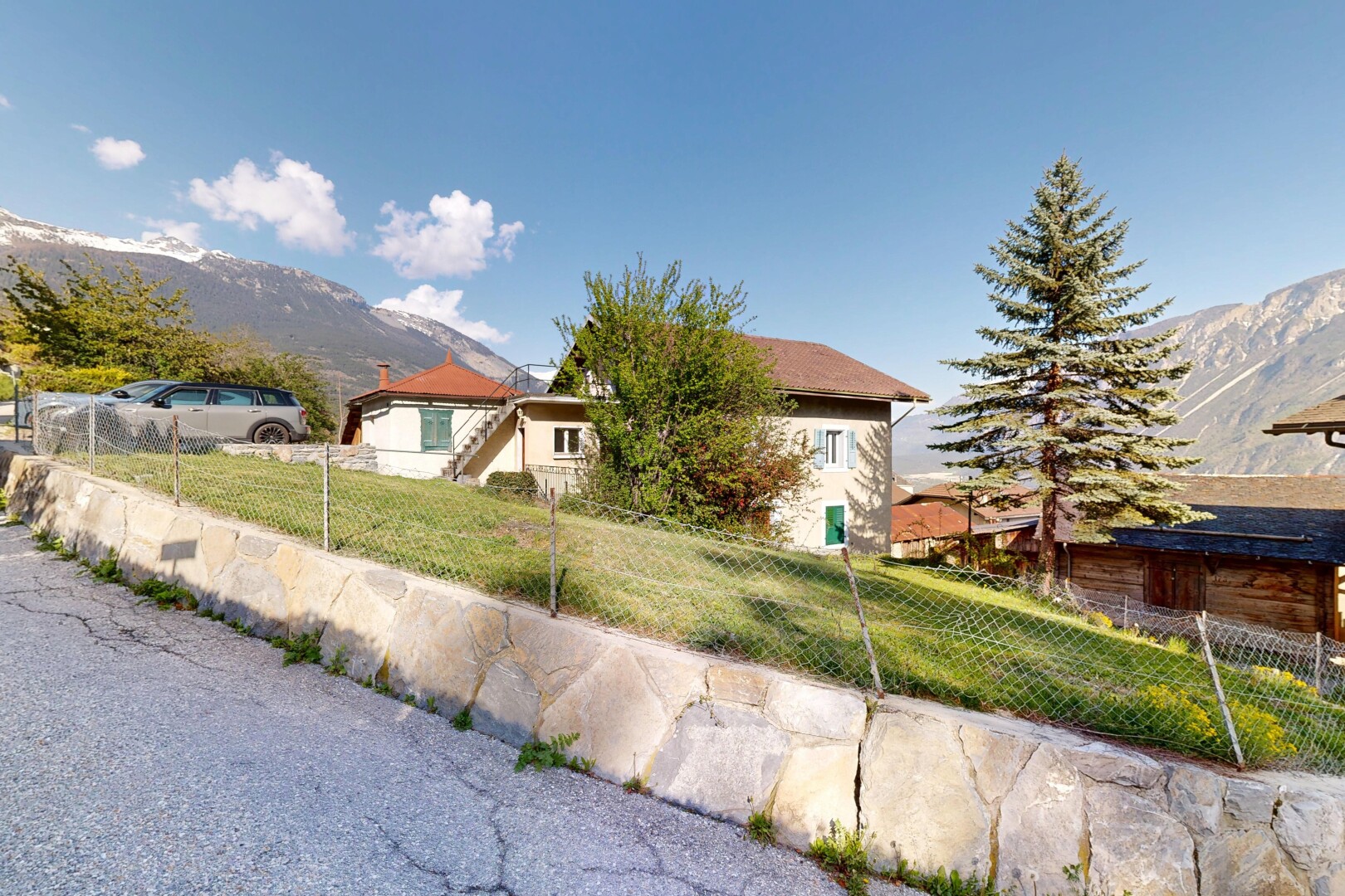view of property featuring a mountain view and a fenced front yard