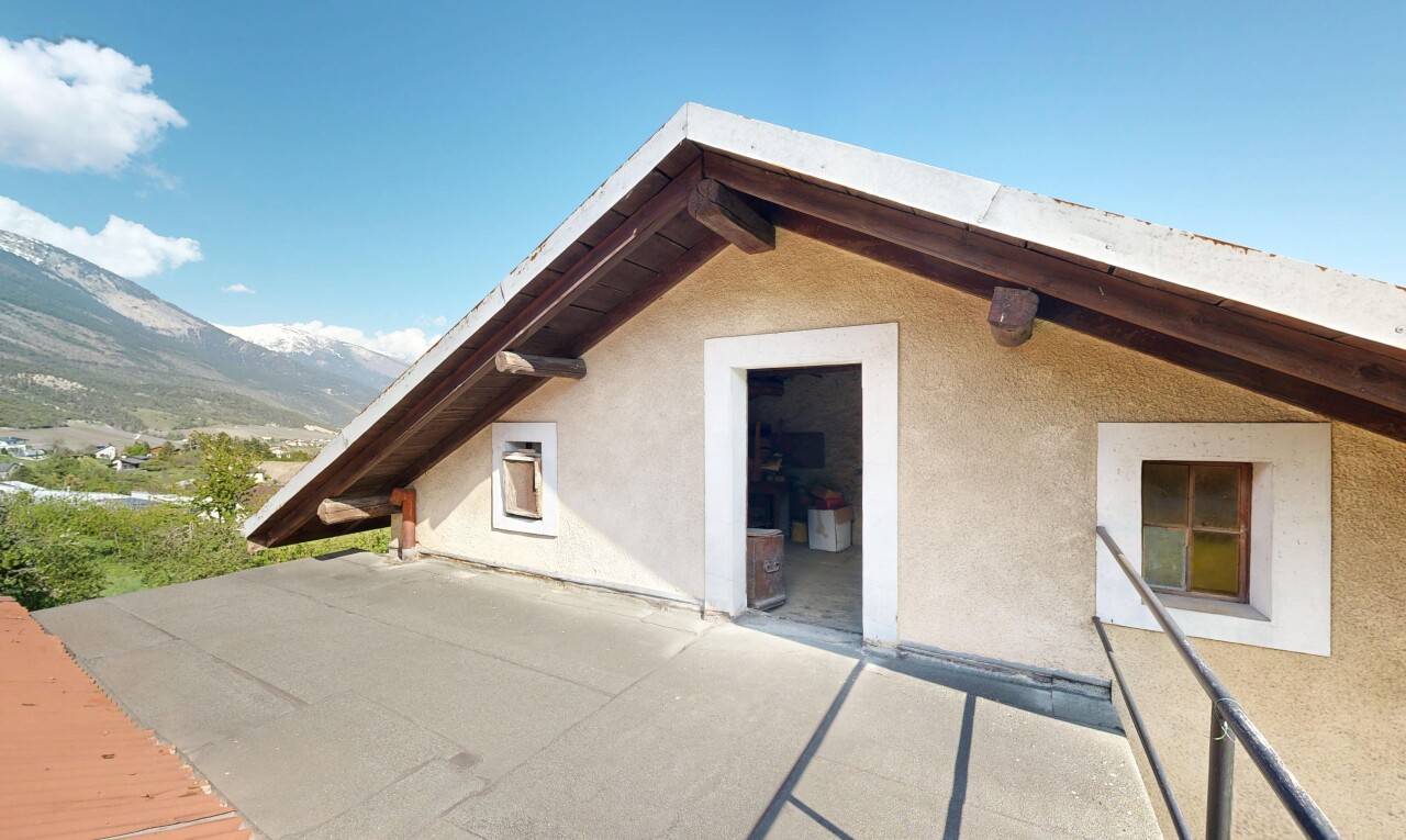 terrace featuring a mountain view