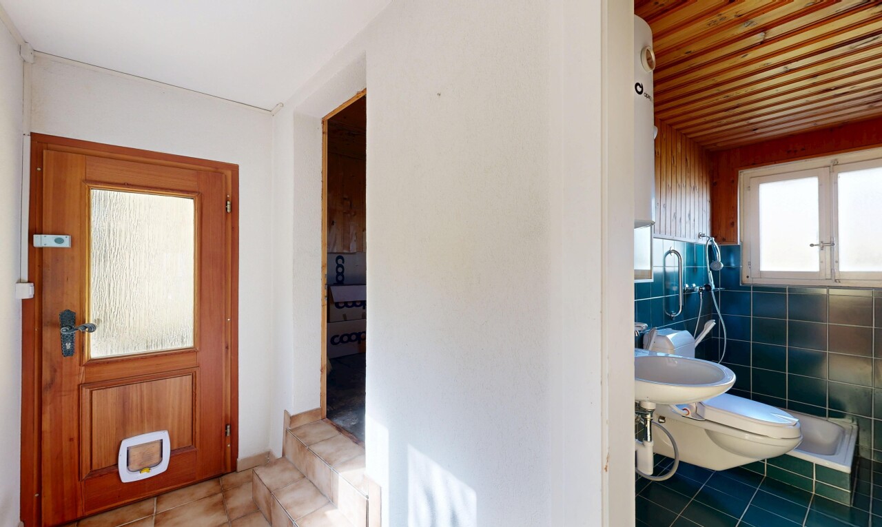 hall featuring tile patterned flooring