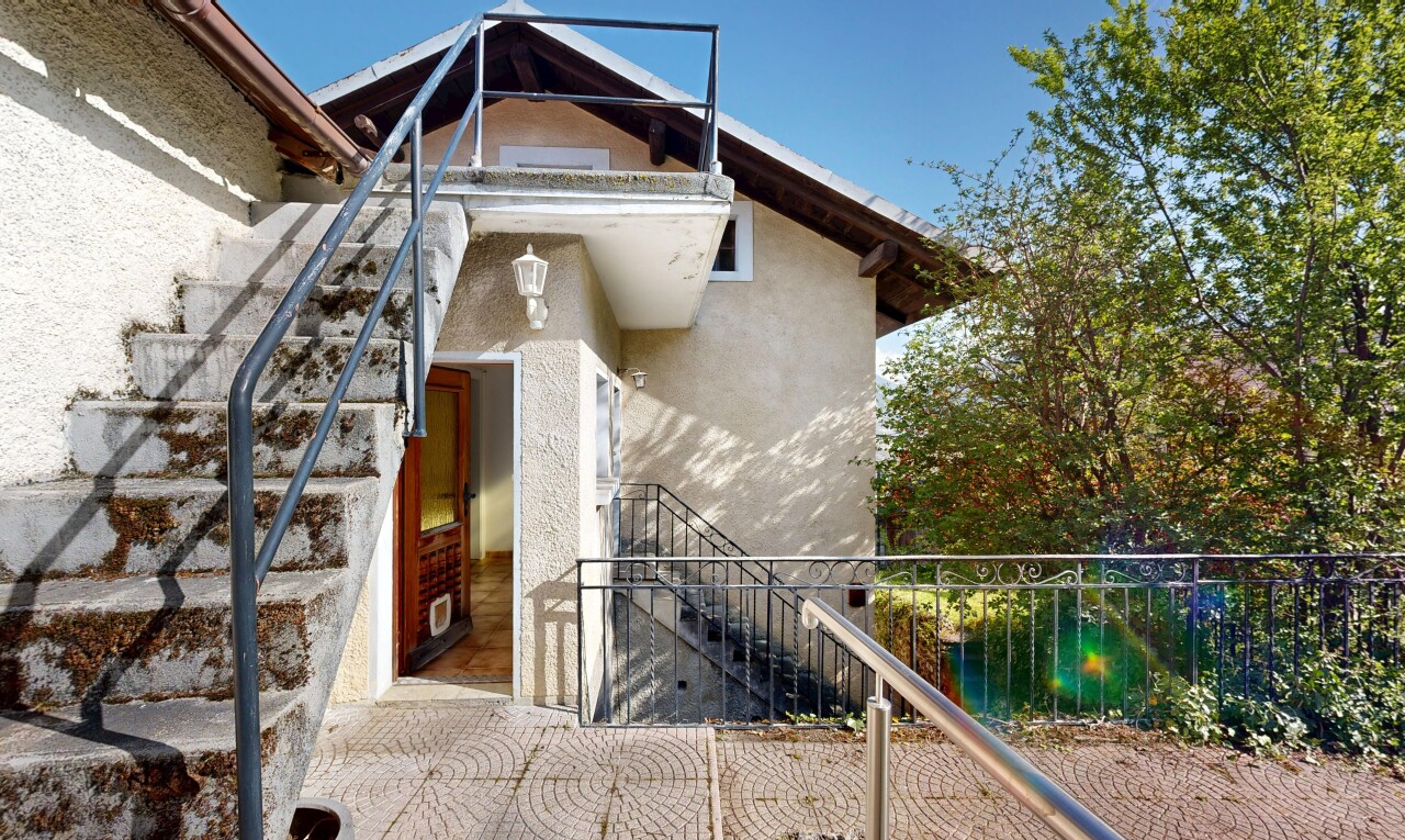 view of property with stucco siding and a balcony