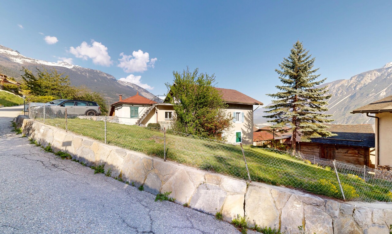 view of property featuring a mountain view and a fenced front yard