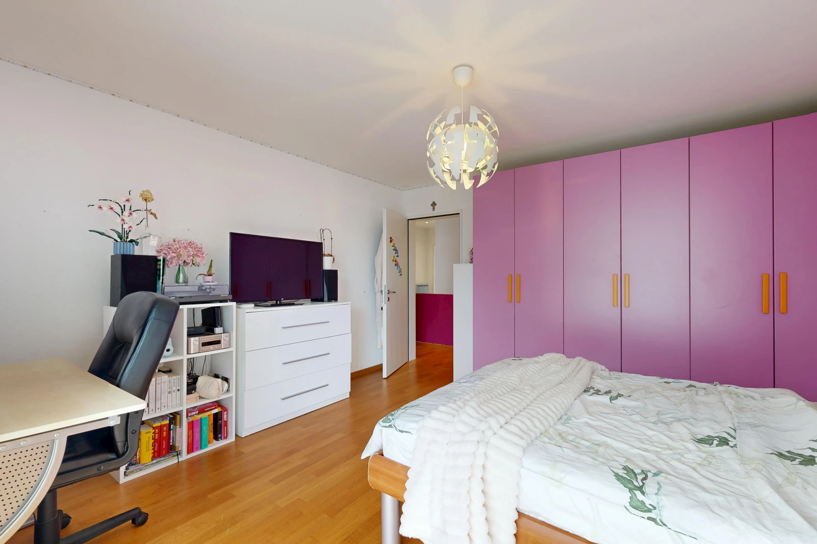 room / bedroom featuring an office area and light wood finished floors