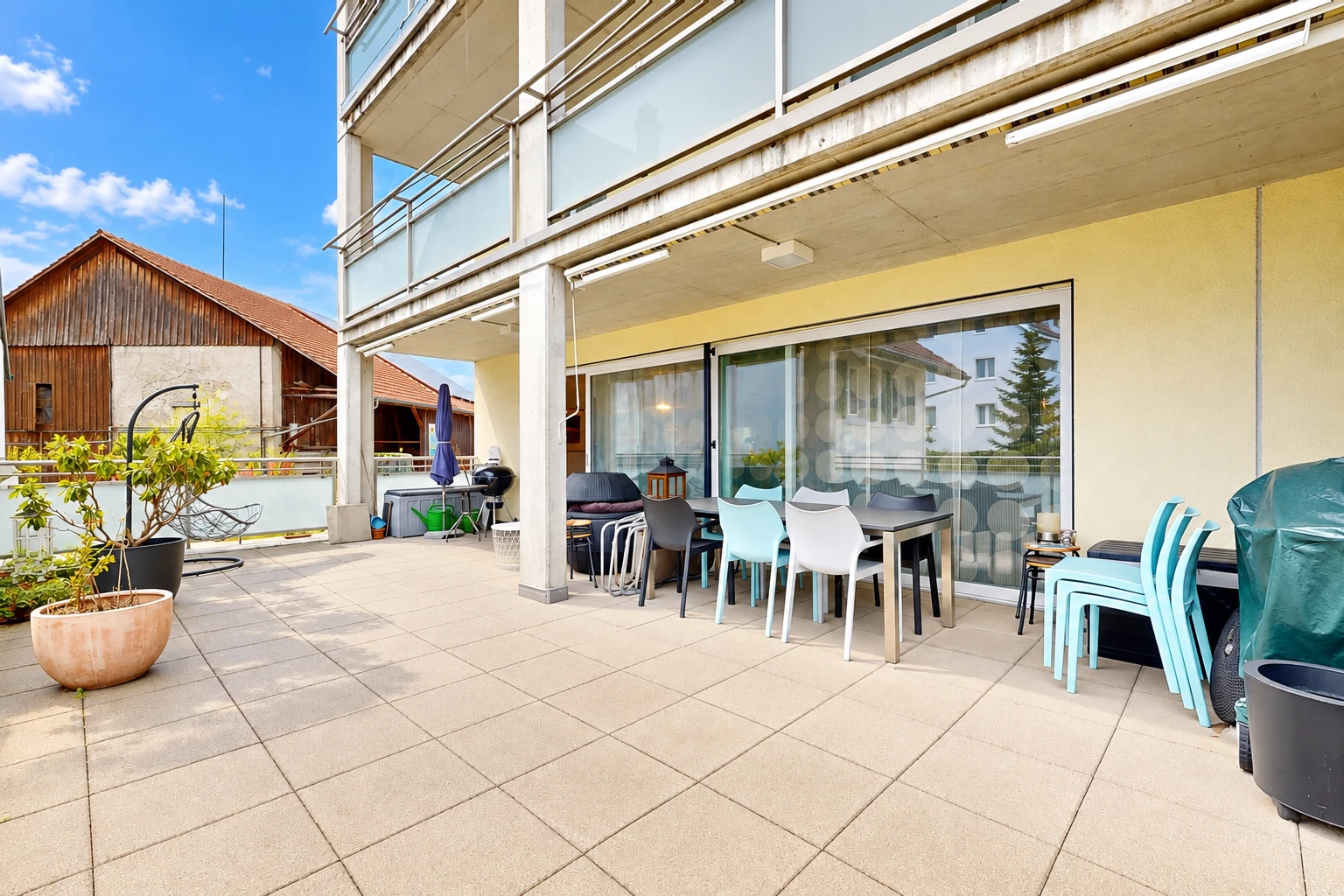 terrace featuring outdoor dining area, a balcony, and a patio area