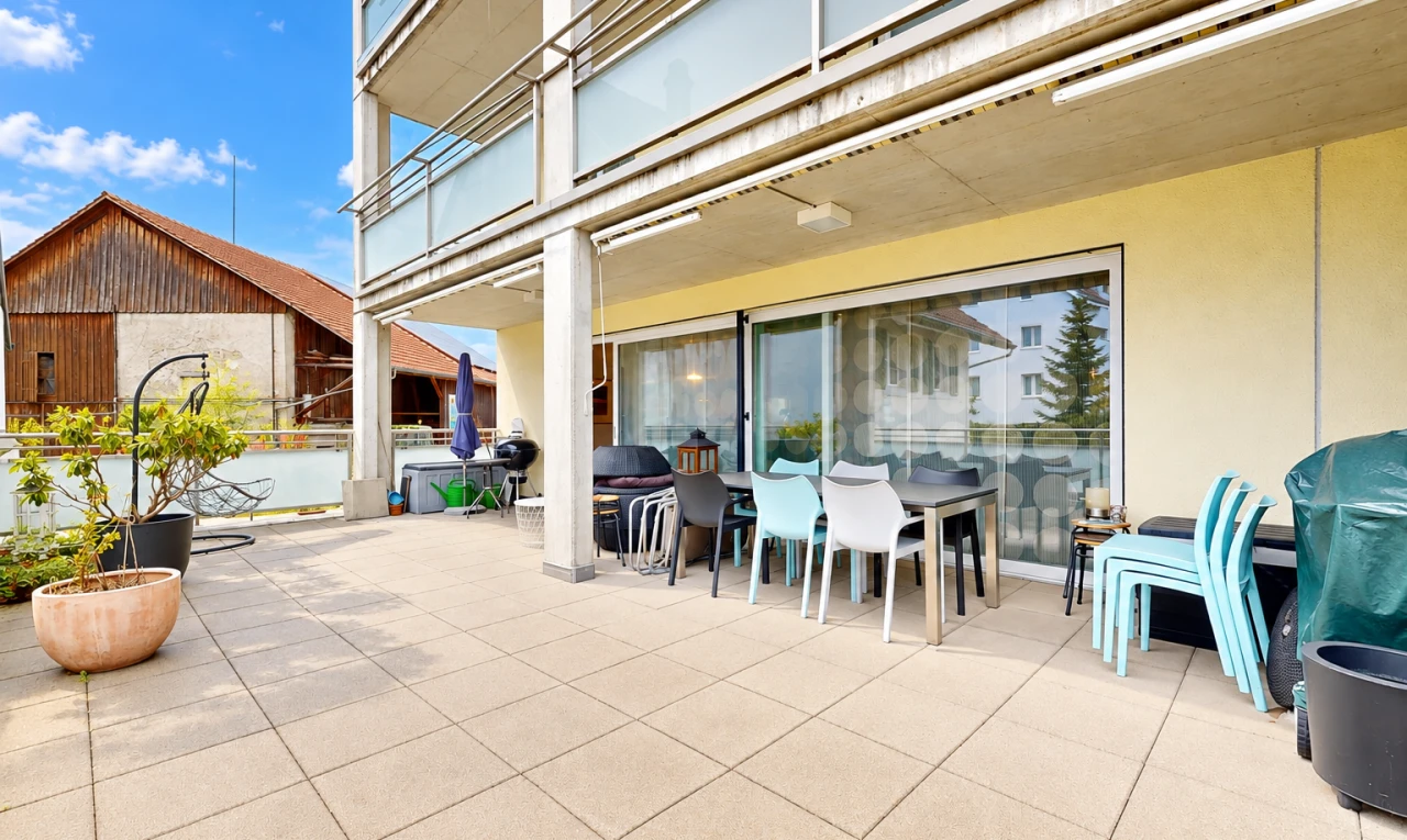 terrace featuring outdoor dining area, a balcony, and a patio area