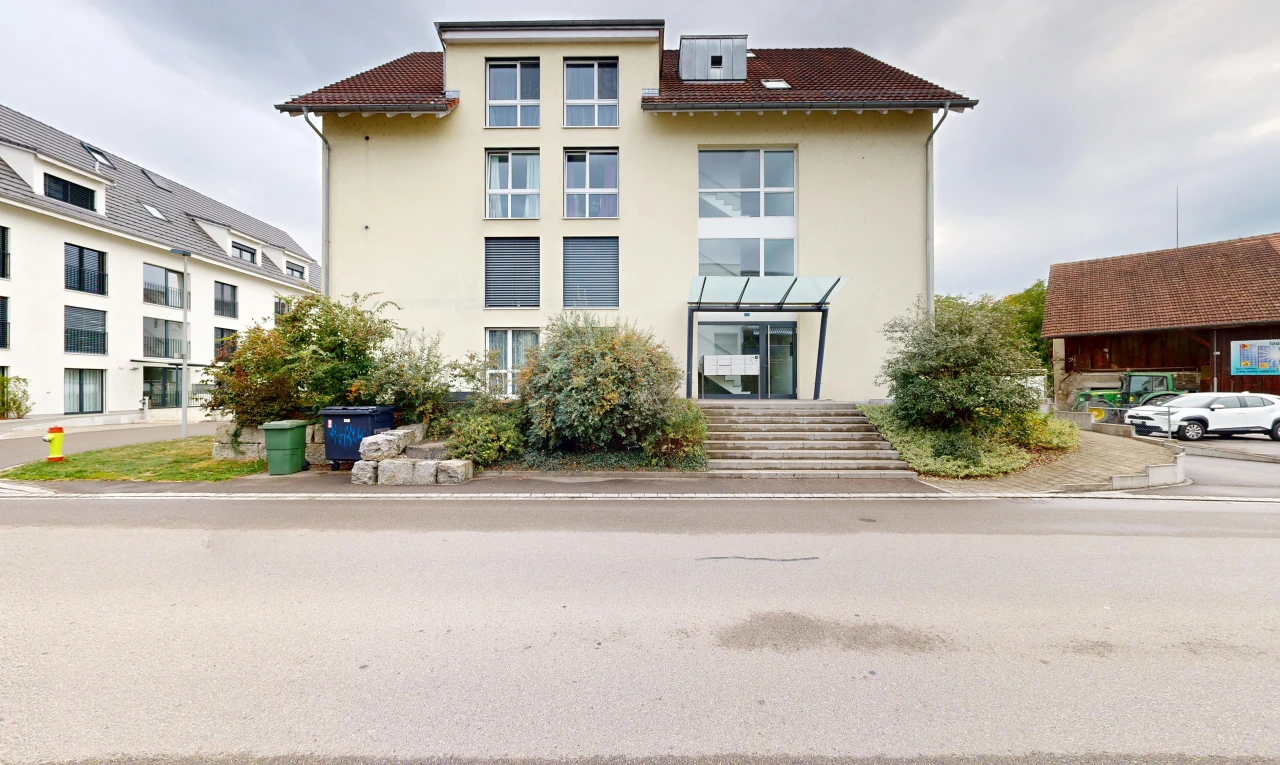 outdoor house with stucco siding and a tiled roof