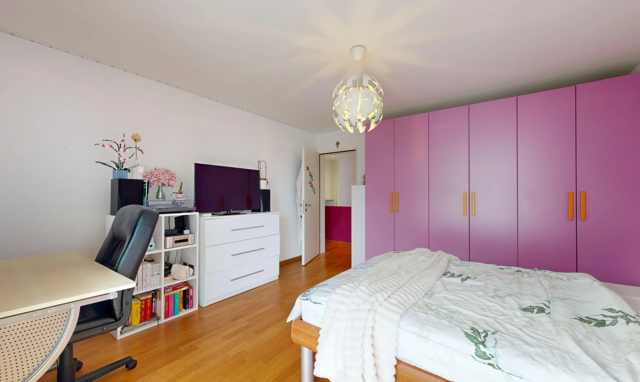 room / bedroom featuring an office area and light wood finished floors